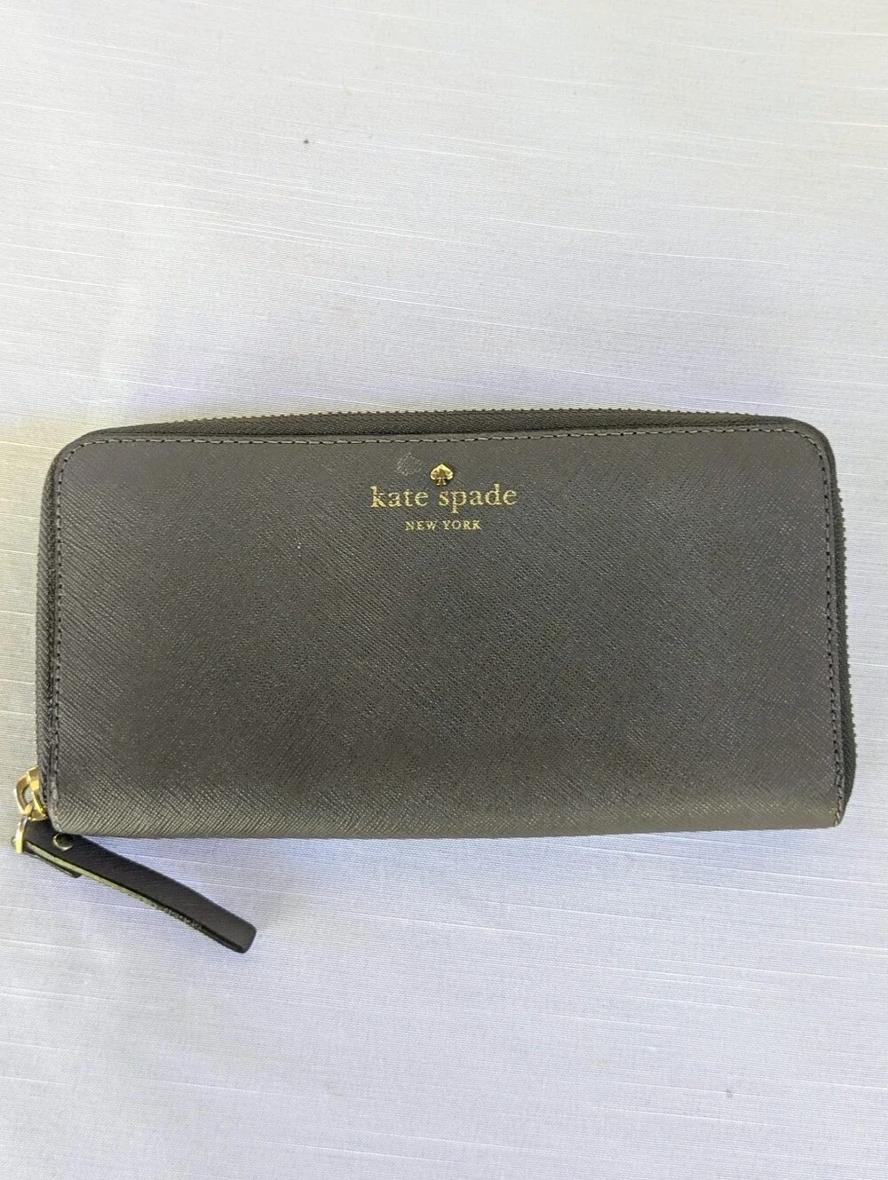 kate spade Gray zip-around saffiano wallet with gold logo